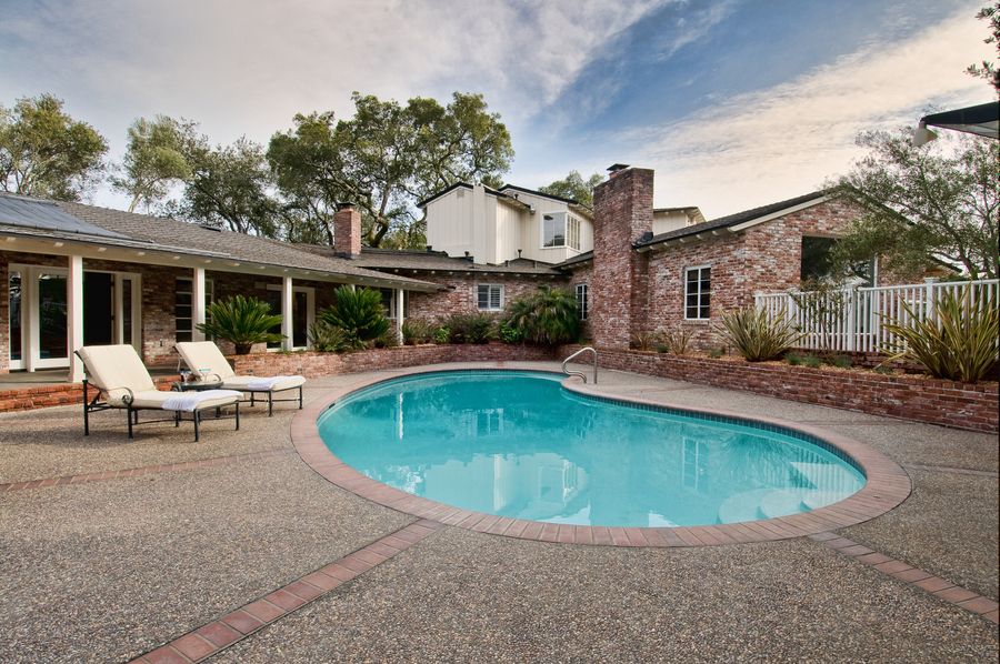 A home with a pool in the backyard.