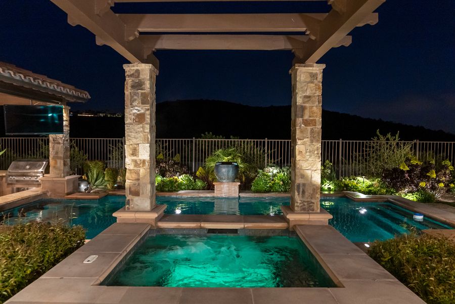 A beautiful outdoor area with a swimming pool and entertainment.