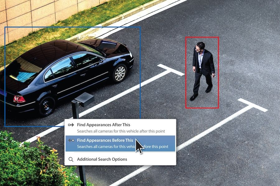 A man and a car in a parking lot from the view of a security camera with people and vehicle recognition.