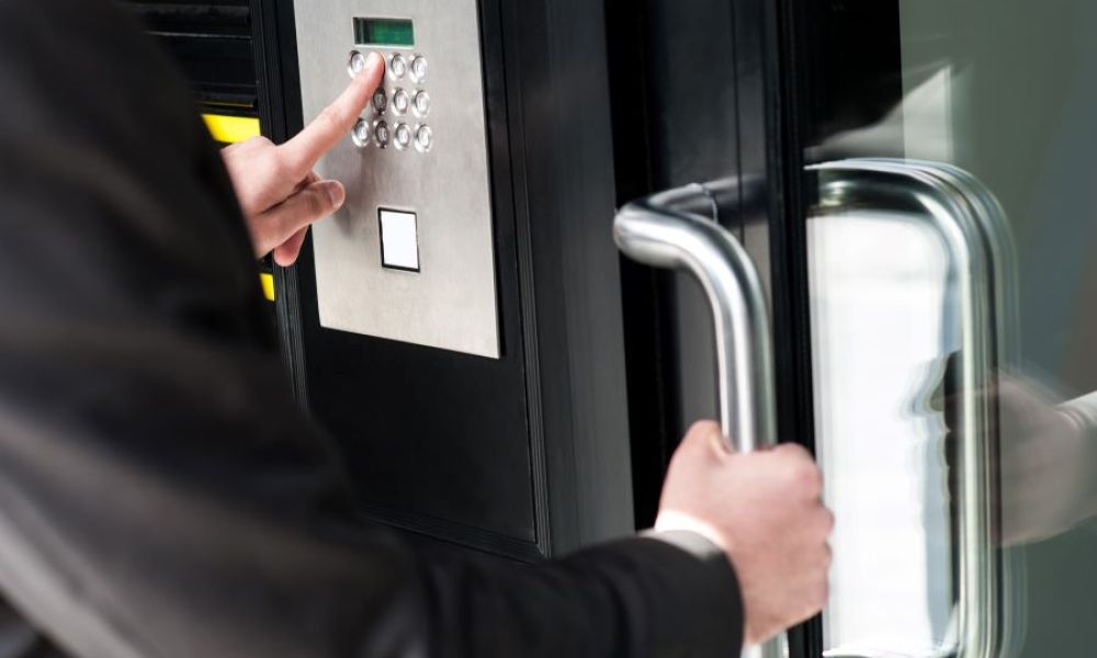 A person gaining access into a building through an access control system.