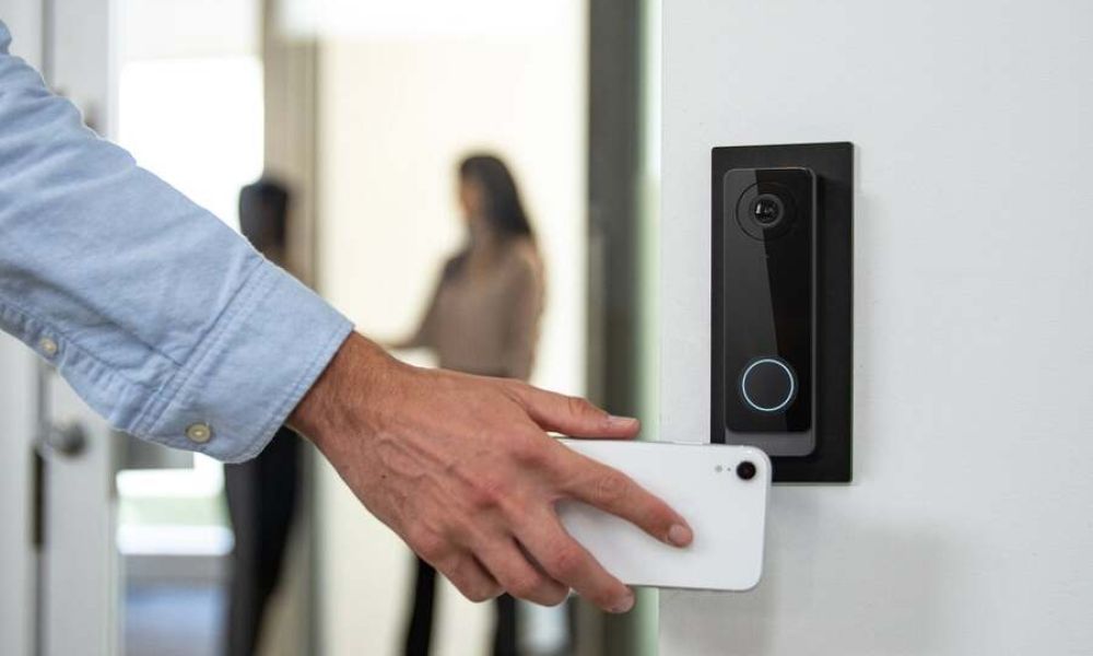 A man uses an access control system to enter his office.